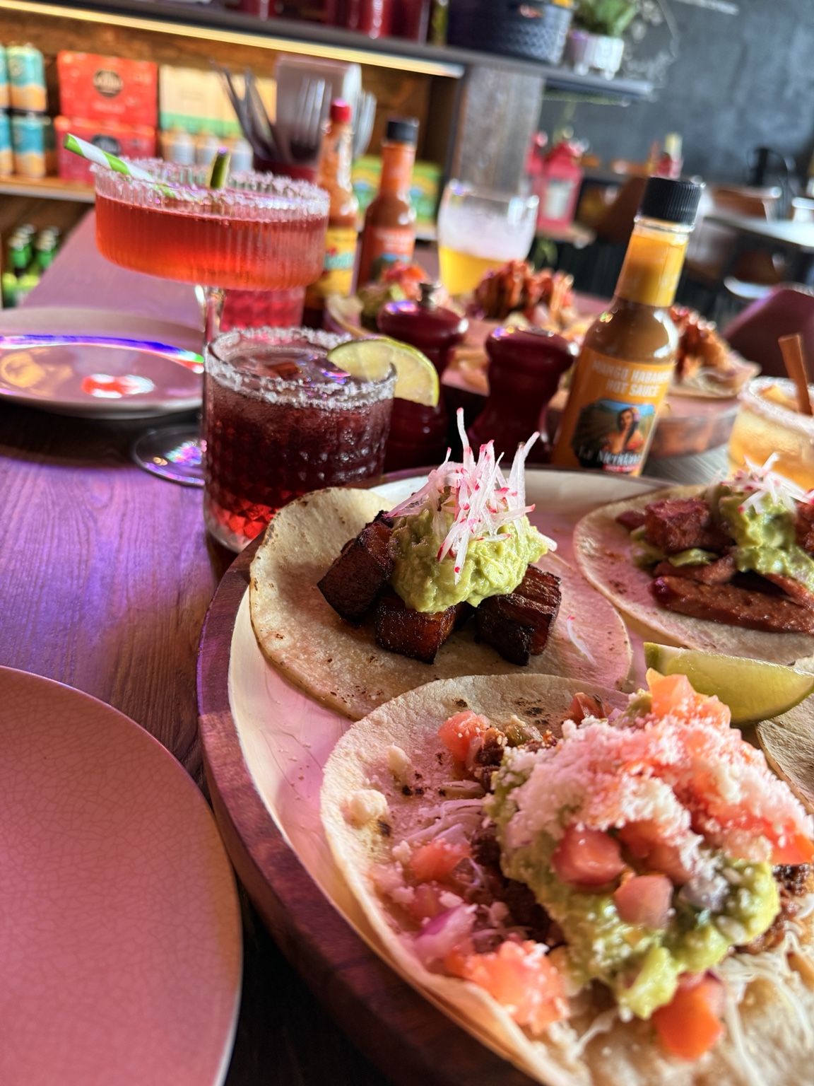 Taco Tuesday tacos with colourful margaritas